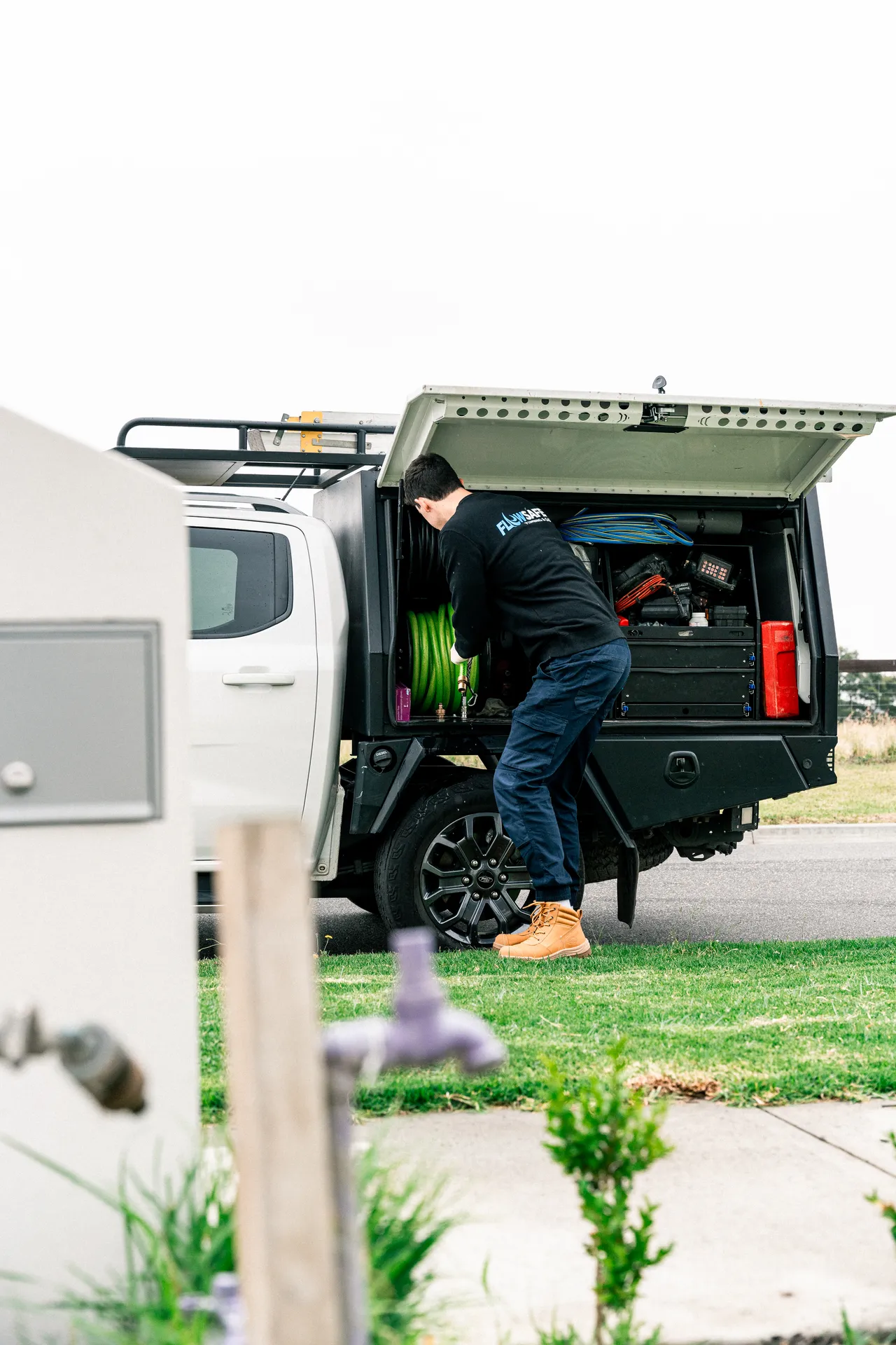 A Mr Drainage plumber working from a fully-equipped service vehicle
